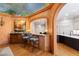 Charming bar area with unique painted ceiling and arched opening that adds to the home's character at 2658 Davis St, Raleigh, NC 27608