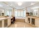 Bright primary bathroom featuring a large soaking tub, vanity, and neutral color palette at 2658 Davis St, Raleigh, NC 27608