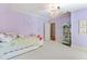 Bedroom with chandelier, crown molding, purple paint, and display cabinet at 2658 Davis St, Raleigh, NC 27608
