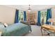 Spacious bedroom showcasing natural light, decorative curtains, a floral sofa, and beautiful decor at 2658 Davis St, Raleigh, NC 27608