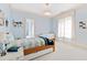 Bedroom with light blue walls, neutral carpet, and bright natural light at 2658 Davis St, Raleigh, NC 27608