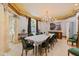 Elegant dining room featuring decorative columns and a full formal table setting at 2658 Davis St, Raleigh, NC 27608