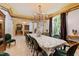 Formal dining room featuring a chandelier, high ceilings, and a full table setting at 2658 Davis St, Raleigh, NC 27608