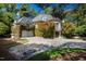 Grand home with a circular driveway, lush landscaping, and climbing ivy on the exterior at 2658 Davis St, Raleigh, NC 27608