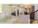 Grand foyer with columns, chandelier, decorative rug, and views into the dining and living rooms at 2658 Davis St, Raleigh, NC 27608
