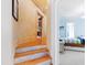 Hallway leading to bedroom with decorative walls and wood and stone flooring at 2658 Davis St, Raleigh, NC 27608