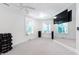 Bright home gym featuring multiple windows, a large mirror, and ample space for fitness equipment at 2658 Davis St, Raleigh, NC 27608