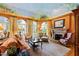 Living room with hand painted ceilings, fireplace, hardwood floors, and multiple seating arrangements at 2658 Davis St, Raleigh, NC 27608