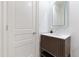 Stylish powder room featuring a modern vanity, sleek fixtures, and a contemporary mirror at 2658 Davis St, Raleigh, NC 27608