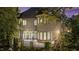 Elegant brick home with a spacious terrace, multiple windows, and manicured greenery at 2658 Davis St, Raleigh, NC 27608