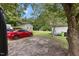 Backyard with sheds, a soccer goal, and a red car parked outside at 2728 Old Milburnie Rd Rd, Raleigh, NC 27604
