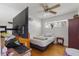 Bright bedroom featuring a ceiling fan, hardwood flooring, and an abundance of natural light at 2728 Old Milburnie Rd Rd, Raleigh, NC 27604