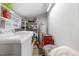 Laundry room with a washer, dryer, and shelving for storage at 2728 Old Milburnie Rd Rd, Raleigh, NC 27604