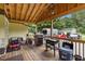 Outdoor kitchen area with a gas grill, a blackstone grill, and patio seating at 2728 Old Milburnie Rd Rd, Raleigh, NC 27604