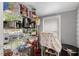 A pantry area with metal shelving units stocked with food and kitchen items at 2728 Old Milburnie Rd Rd, Raleigh, NC 27604