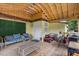 Covered porch with an inviting seating area, complete with a small sofa and armchairs at 2728 Old Milburnie Rd Rd, Raleigh, NC 27604