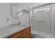 Bathroom with wood cabinet and marble countertop, along with a glass-enclosed shower at 276 Sagamore Dr, Louisburg, NC 27549
