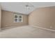 Bedroom with neutral walls, carpet flooring, ample natural light, and ceiling fan at 276 Sagamore Dr, Louisburg, NC 27549
