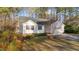Charming one-story home with light siding, black shutters, manicured lawn, and mature landscaping at 276 Sagamore Dr, Louisburg, NC 27549