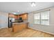 Kitchen with breakfast bar, stainless steel appliances, and wood cabinetry at 276 Sagamore Dr, Louisburg, NC 27549