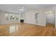 Bright living room with hardwood floors, fireplace, large windows and vaulted ceilings at 276 Sagamore Dr, Louisburg, NC 27549