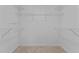 Walk-in closet is carpeted and has white shelving at 276 Sagamore Dr, Louisburg, NC 27549
