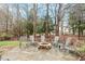 Outdoor fire pit with comfortable seating in backyard at 3025 Osterley St, Raleigh, NC 27614