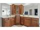 Bathroom features double sinks with wood cabinets and storage with tiled floors at 3025 Osterley St, Raleigh, NC 27614