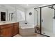 Bathroom featuring a shower, soaking tub, and vanity with wood cabinet at 3025 Osterley St, Raleigh, NC 27614
