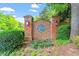Brick community sign with landscaping, marking the entrance of a distinguished neighborhood at 3025 Osterley St, Raleigh, NC 27614