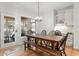 Bright dining area with wood table, bench, and view to outside at 3025 Osterley St, Raleigh, NC 27614