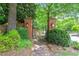 Elegant brick entrance with manicured hedges, offering a serene gateway to the neighborhood at 3025 Osterley St, Raleigh, NC 27614