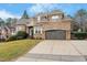Charming brick home with a two-car garage and well-manicured landscaping at 3025 Osterley St, Raleigh, NC 27614