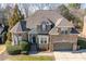 Beautiful brick home featuring a well-maintained lawn and charming architectural details at 3025 Osterley St, Raleigh, NC 27614