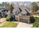 Beautiful brick home featuring a well-maintained lawn and charming architectural details at 3025 Osterley St, Raleigh, NC 27614
