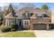 Charming two-story brick home with manicured landscaping and a two-car garage at 3025 Osterley St, Raleigh, NC 27614
