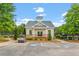 Charming exterior view of a community building featuring a manicured lawn, and ample parking at 3025 Osterley St, Raleigh, NC 27614