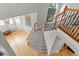 Spacious foyer featuring a staircase with hardwood floors and railing at 3025 Osterley St, Raleigh, NC 27614