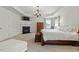 Large main bedroom boasts tray ceilings, a fireplace, and neutral carpeting at 3025 Osterley St, Raleigh, NC 27614