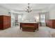 Expansive main bedroom features tray ceiling, chandelier, and plenty of space at 3025 Osterley St, Raleigh, NC 27614