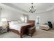 Spacious primary bedroom includes tray ceilings, and bedside tables at 3025 Osterley St, Raleigh, NC 27614