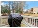 A covered BBQ grill sits on a wooden porch ready for outdoor cooking at 3025 Osterley St, Raleigh, NC 27614