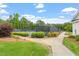 Well-maintained tennis courts with green surroundings, ideal for active recreation and community engagement at 3025 Osterley St, Raleigh, NC 27614