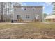 Expansive backyard view featuring a two-story home with a fenced perimeter at 3102 Seth Dr, Sanford, NC 27330