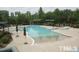 Resort-style community pool with ample seating and shaded areas for relaxation and fun in the sun at 314 Fenmore Pl, Cary, NC 27519