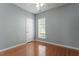 This bedroom is bright and airy, with hardwood floors and a large window at 314 Fenmore Pl, Cary, NC 27519