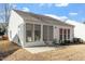 A delightful sunroom extends the living space, perfect for enjoying tranquil moments and outdoor views at 314 Fenmore Pl, Cary, NC 27519