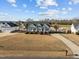 Charming front exterior view of a well-manicured home with lush landscaping, a long driveway and a welcoming facade at 3471 Wagon Wheel Rd, Rocky Mount, NC 27804