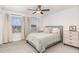 Bright bedroom featuring large windows, a comfortable bed, and modern furnishings, creating a serene retreat at 349 Shadow Falls Dr, Wendell, NC 27591