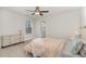 Cozy bedroom with a view of the bathroom, features an attractive ceiling fan and comfortable furnishings at 349 Shadow Falls Dr, Wendell, NC 27591